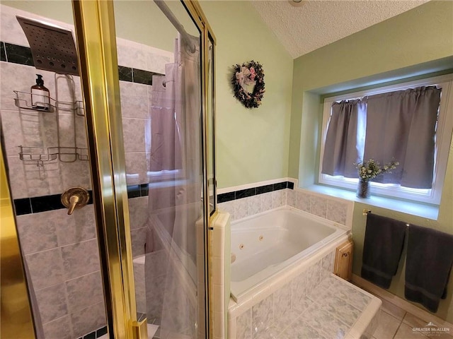 full bath with tile patterned floors, a stall shower, a jetted tub, and a textured ceiling