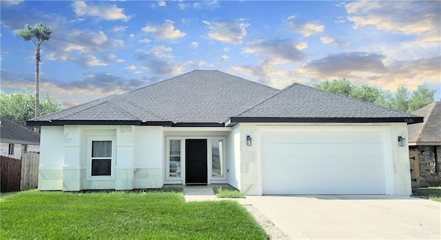 1320 Carolina Ave, Edinburg, TX 78541 - view of front of home featuring an attached garage, driveway, roof with shingles, and stucco siding