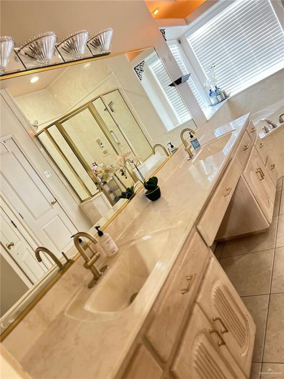 bathroom featuring tile patterned flooring and vanity