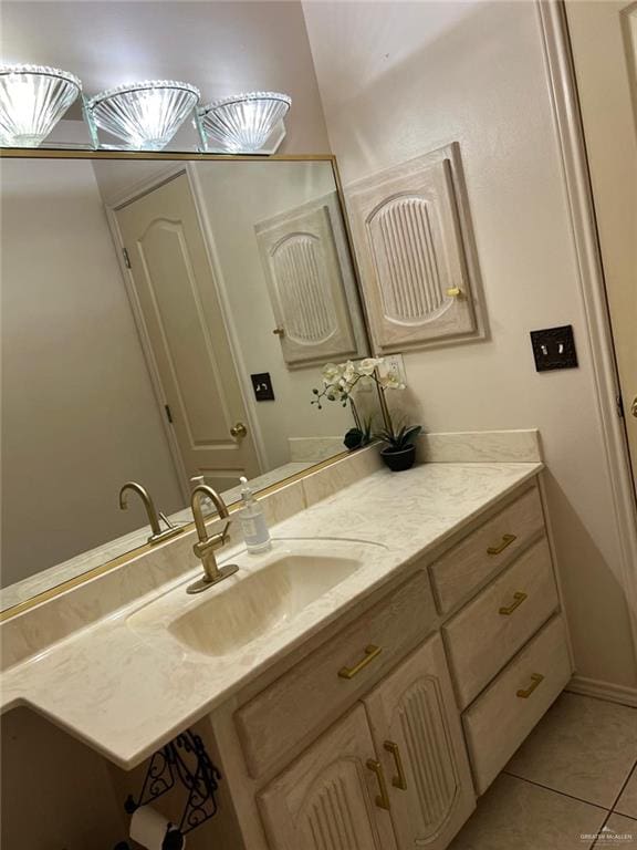 bathroom with tile patterned flooring and vanity