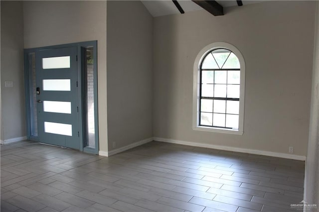 entrance foyer with beam ceiling and light hardwood / wood-style flooring