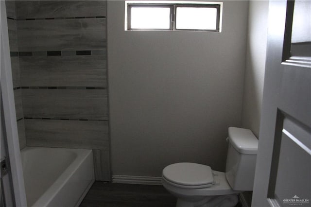 bathroom featuring wood-type flooring and toilet