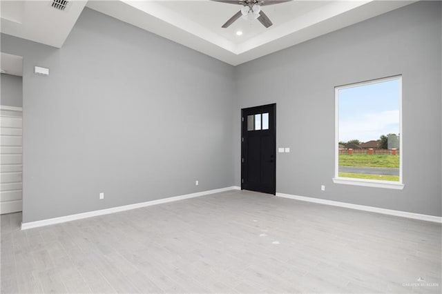 interior space with ceiling fan and light hardwood / wood-style flooring