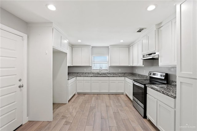 17231 Mandarin Ave, Harlingen, TX 78552 - kitchen featuring a sink, stainless steel electric stove, white cabinets, under cabinet range hood, and visible vents
