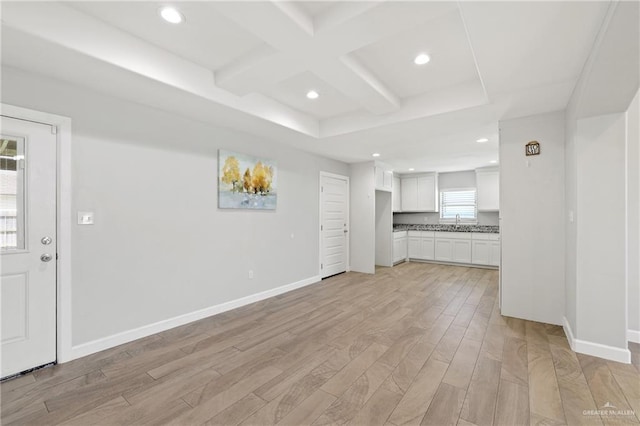 17231 Mandarin Ave, Harlingen, TX 78552 - unfurnished living room with baseboards, recessed lighting, and light wood-type flooring