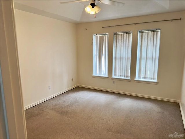 carpeted empty room with ceiling fan