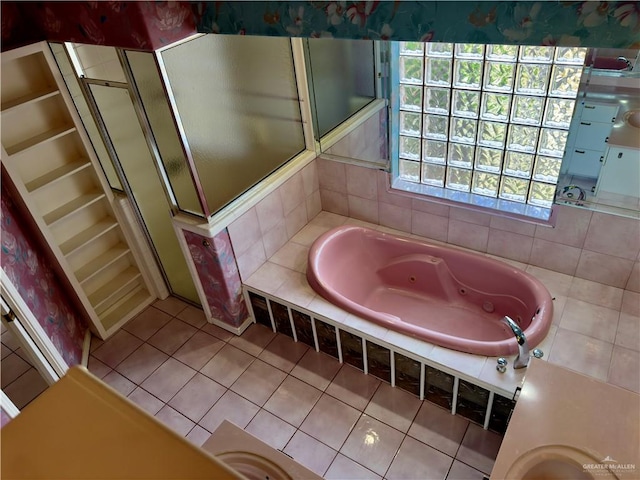 bathroom with a bathing tub and tile patterned flooring