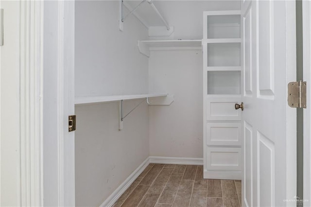 spacious closet featuring wood finished floors