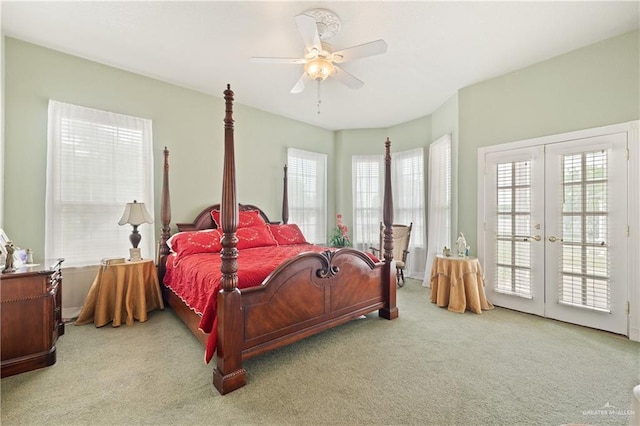 bedroom with light carpet, access to outside, french doors, and ceiling fan