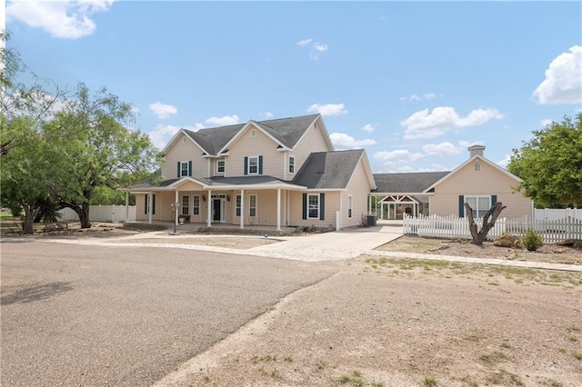 view of front of house featuring a porch and a carport