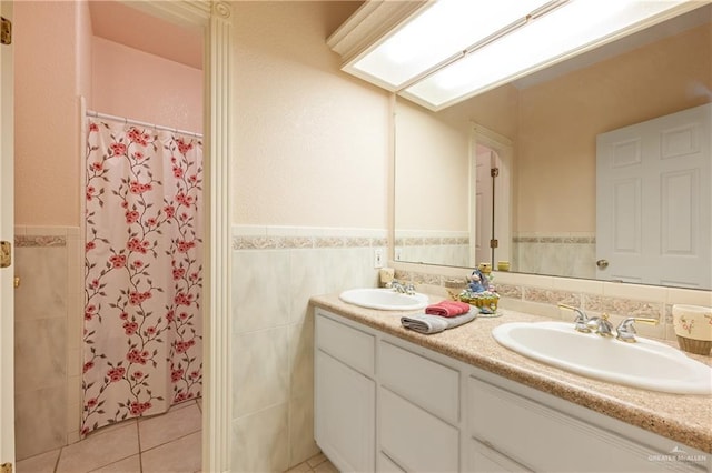 bathroom featuring tile walls, vanity, a shower with curtain, and tile patterned floors