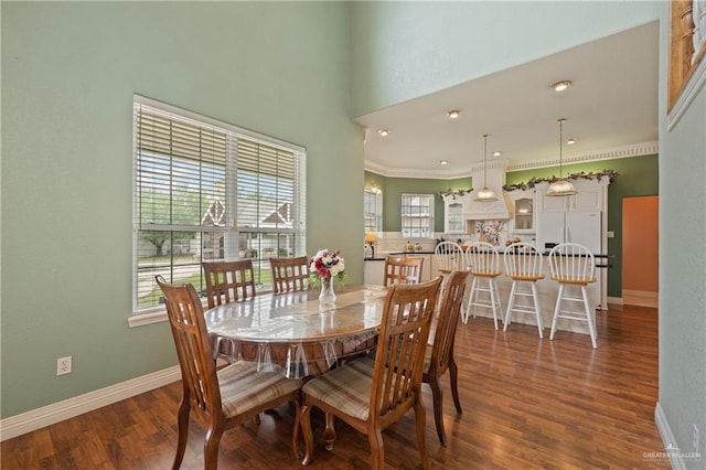 dining room featuring crown molding and dark hardwood / wood-style floors