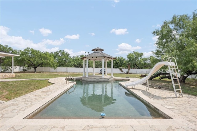 view of swimming pool featuring a gazebo and a water slide