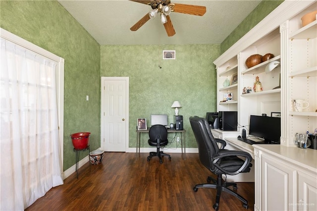 home office with built in shelves, dark hardwood / wood-style floors, and ceiling fan