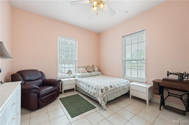 tiled bedroom with multiple windows and ceiling fan