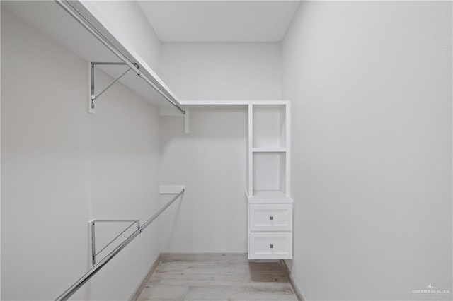 1216 N Lincoln Ave, San Juan, TX 78589 - walk in closet with light wood finished floors