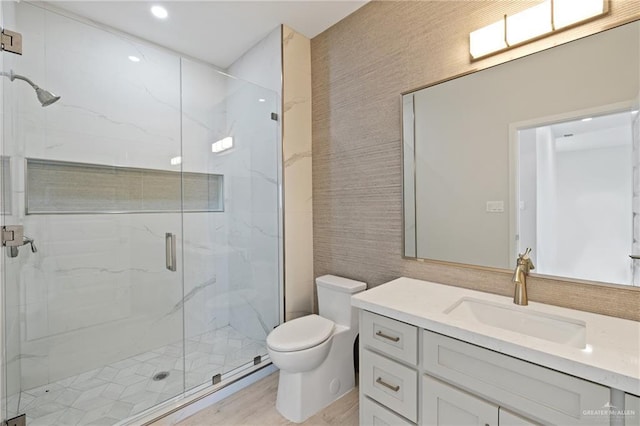 1216 N Lincoln Ave, San Juan, TX 78589 - bathroom with toilet, a marble finish shower, vanity, and wood finished floors