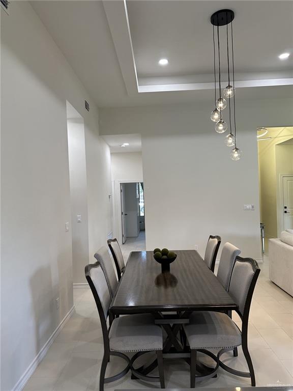3108 E Kennedy Ave, Alton, TX 78573 - dining space featuring baseboards and recessed lighting