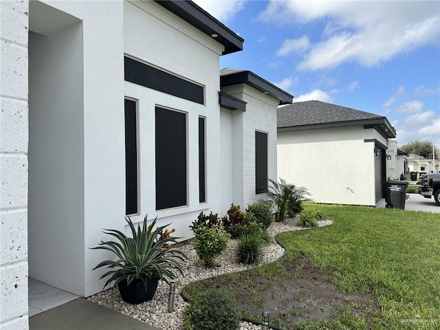 view of property exterior with a lawn