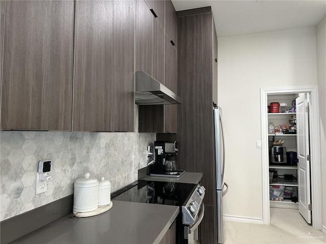 3108 E Kennedy Ave, Alton, TX 78573 - kitchen with stainless steel appliances, wall chimney range hood, modern cabinets, dark brown cabinets, and decorative backsplash