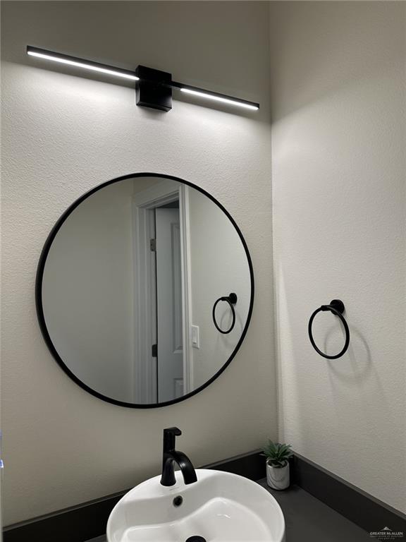 3108 E Kennedy Ave, Alton, TX 78573 - bathroom featuring a sink