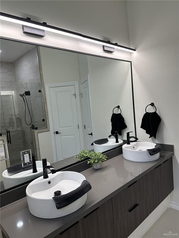 3108 E Kennedy Ave, Alton, TX 78573 - full bath featuring double vanity and a stall shower