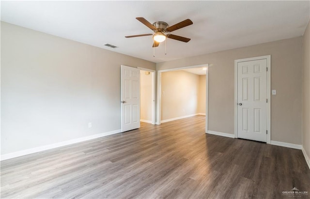 spare room featuring ceiling fan and hardwood / wood-style flooring