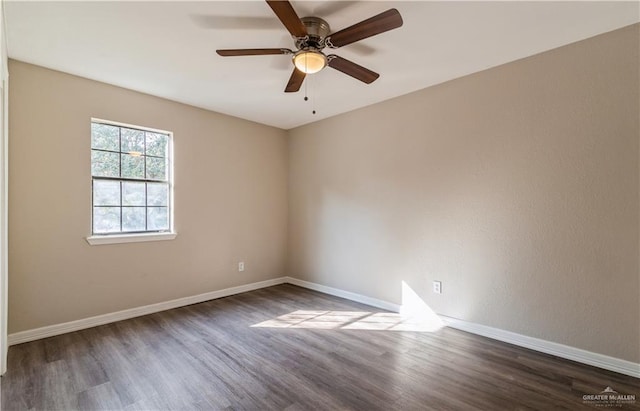 empty room featuring dark hardwood / wood-style floors and ceiling fan