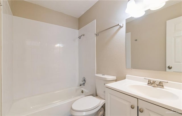 full bathroom featuring vanity, toilet, and tiled shower / bath