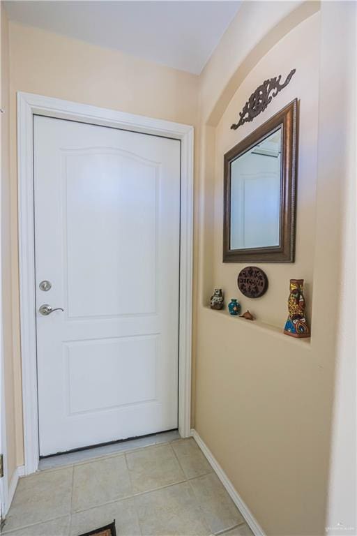 entryway featuring light tile patterned floors