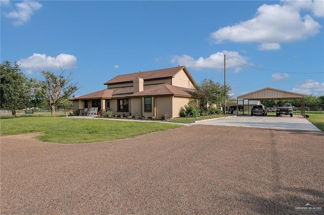5213 Mile 8 1/2 Rd, Edinburg, TX 78541 - view of front facade featuring driveway, a front lawn, and a detached carport
