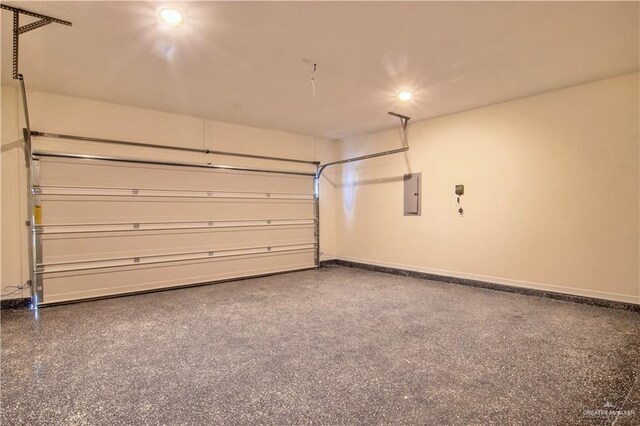 2310 Corales St, Mission, TX 78573 - garage with electric panel, baseboards, and recessed lighting