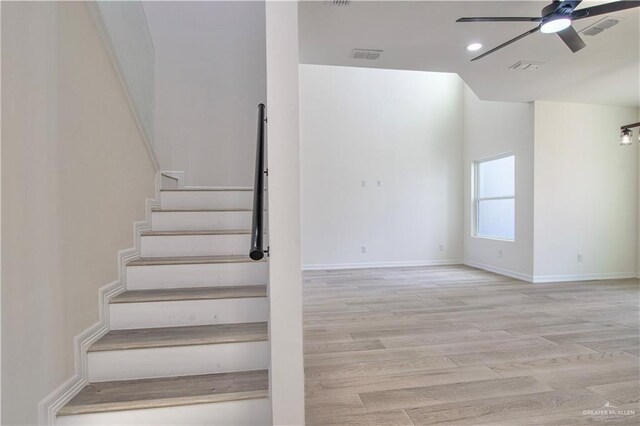 2310 Corales St, Mission, TX 78573 - staircase featuring a ceiling fan, wood finished floors, baseboards, recessed lighting, and vaulted ceiling
