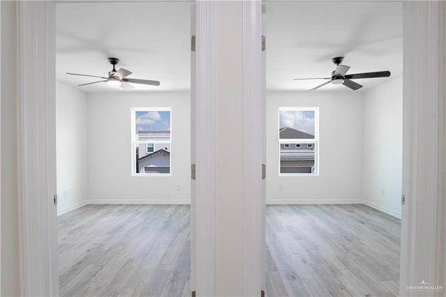 2310 Corales St, Mission, TX 78573 - unfurnished room with ceiling fan, light wood-style flooring, and baseboards