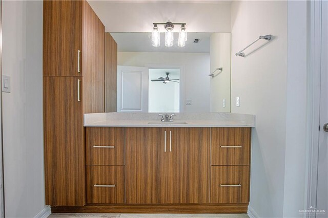 2310 Corales St, Mission, TX 78573 - bathroom featuring vanity and baseboards