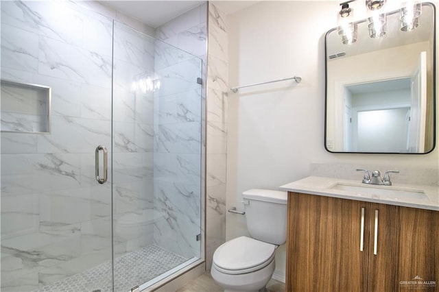 2310 Corales St, Mission, TX 78573 - bathroom with toilet, a marble finish shower, and vanity