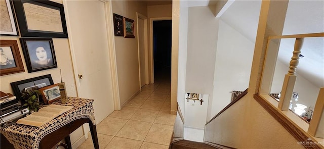 hall featuring light tile patterned floors