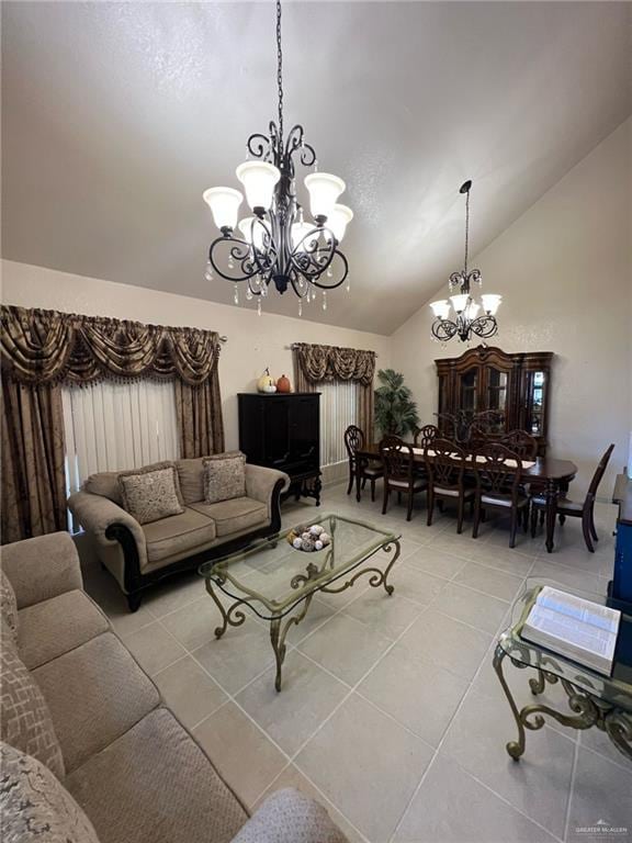 living room featuring vaulted ceiling, light tile patterned floors, and an inviting chandelier