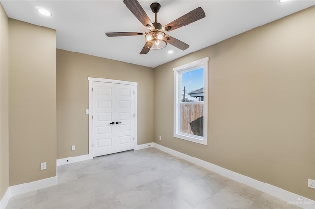 unfurnished room with ceiling fan