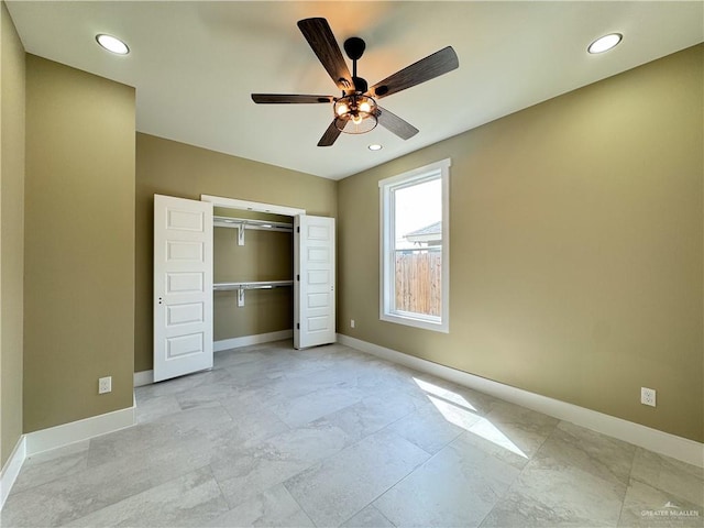 unfurnished bedroom featuring ceiling fan and a closet