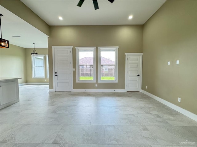 unfurnished room featuring ceiling fan