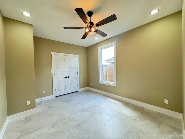 unfurnished bedroom featuring a closet and ceiling fan