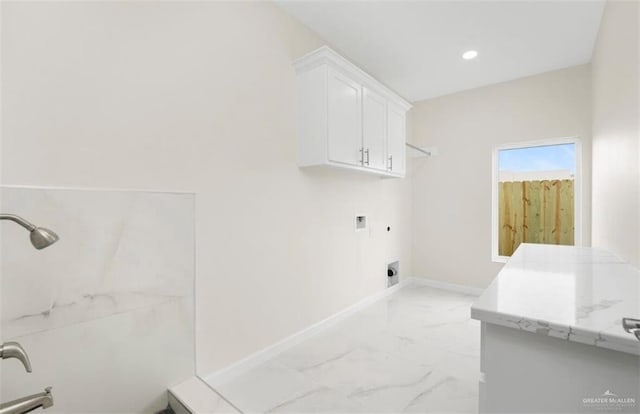 laundry area with cabinets, hookup for a washing machine, hookup for a gas dryer, and hookup for an electric dryer