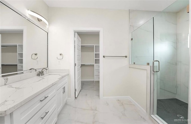 bathroom featuring vanity and an enclosed shower