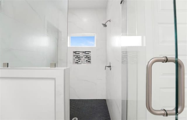 bathroom featuring an enclosed shower