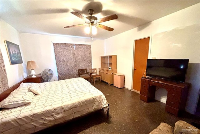 bedroom with a ceiling fan and baseboards