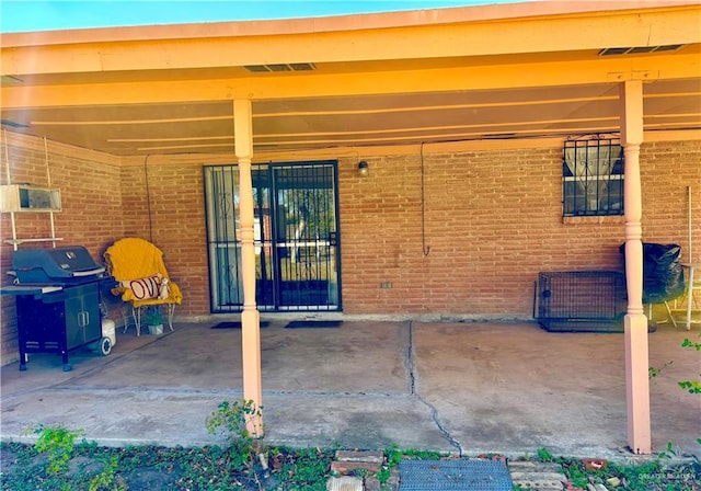 view of patio / terrace with a grill and visible vents