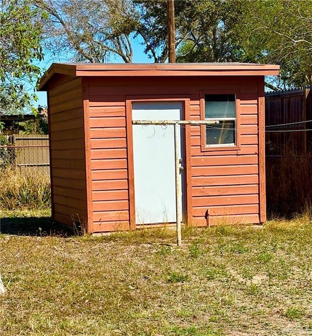 view of shed with fence