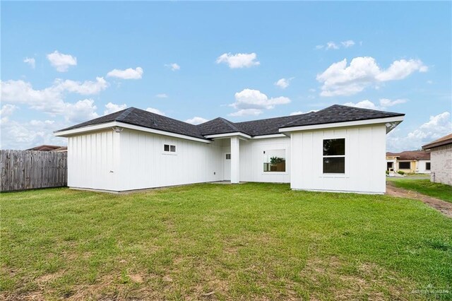 3513 E Adams Ave, Alton, TX 78573 - rear view of property featuring board and batten siding