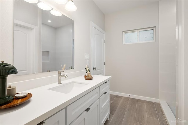 3513 E Adams Ave, Alton, TX 78573 - bathroom featuring vanity, wood tiled floors, and baseboards